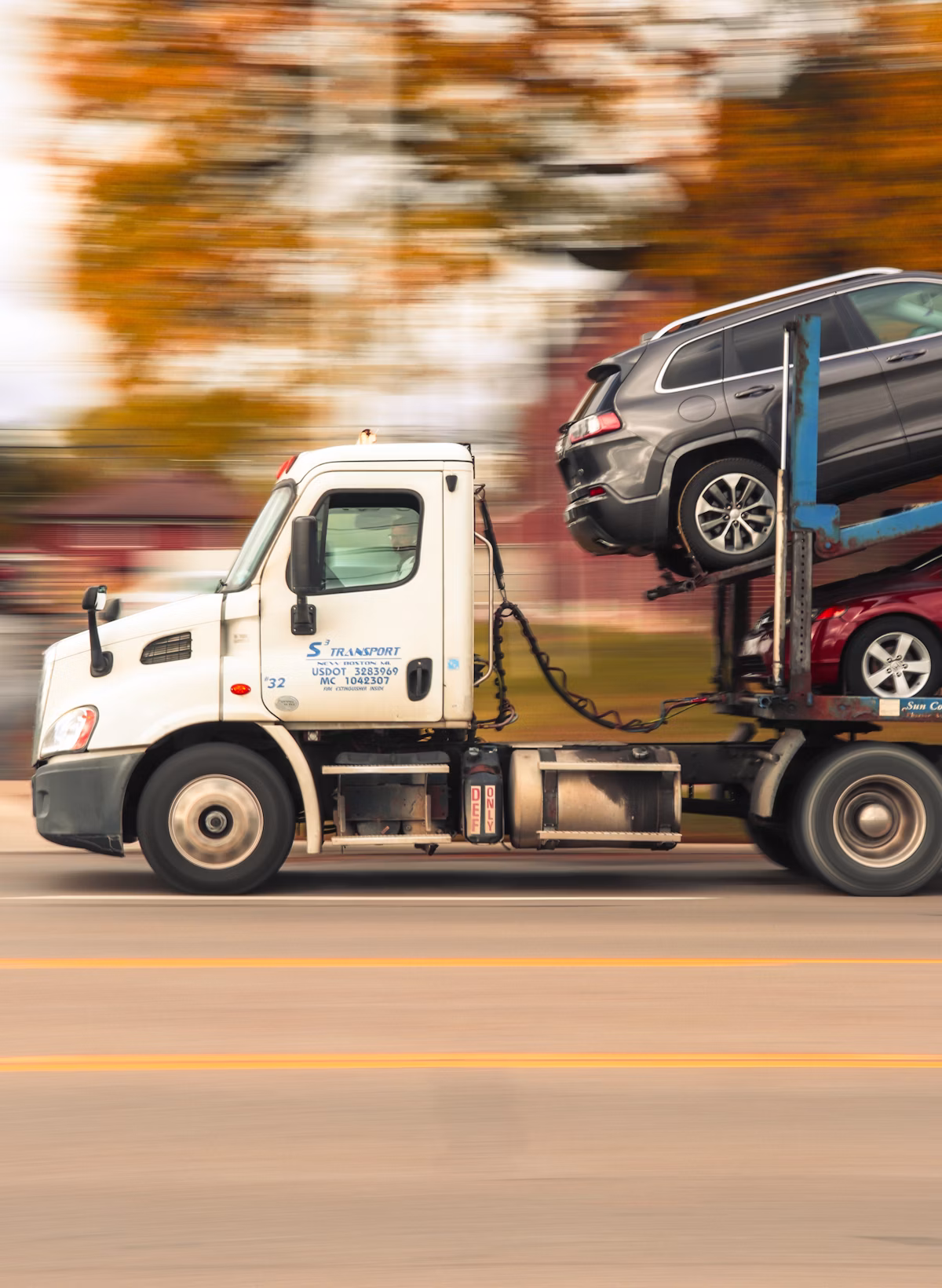 Car carrier truck loading vehicles for transport