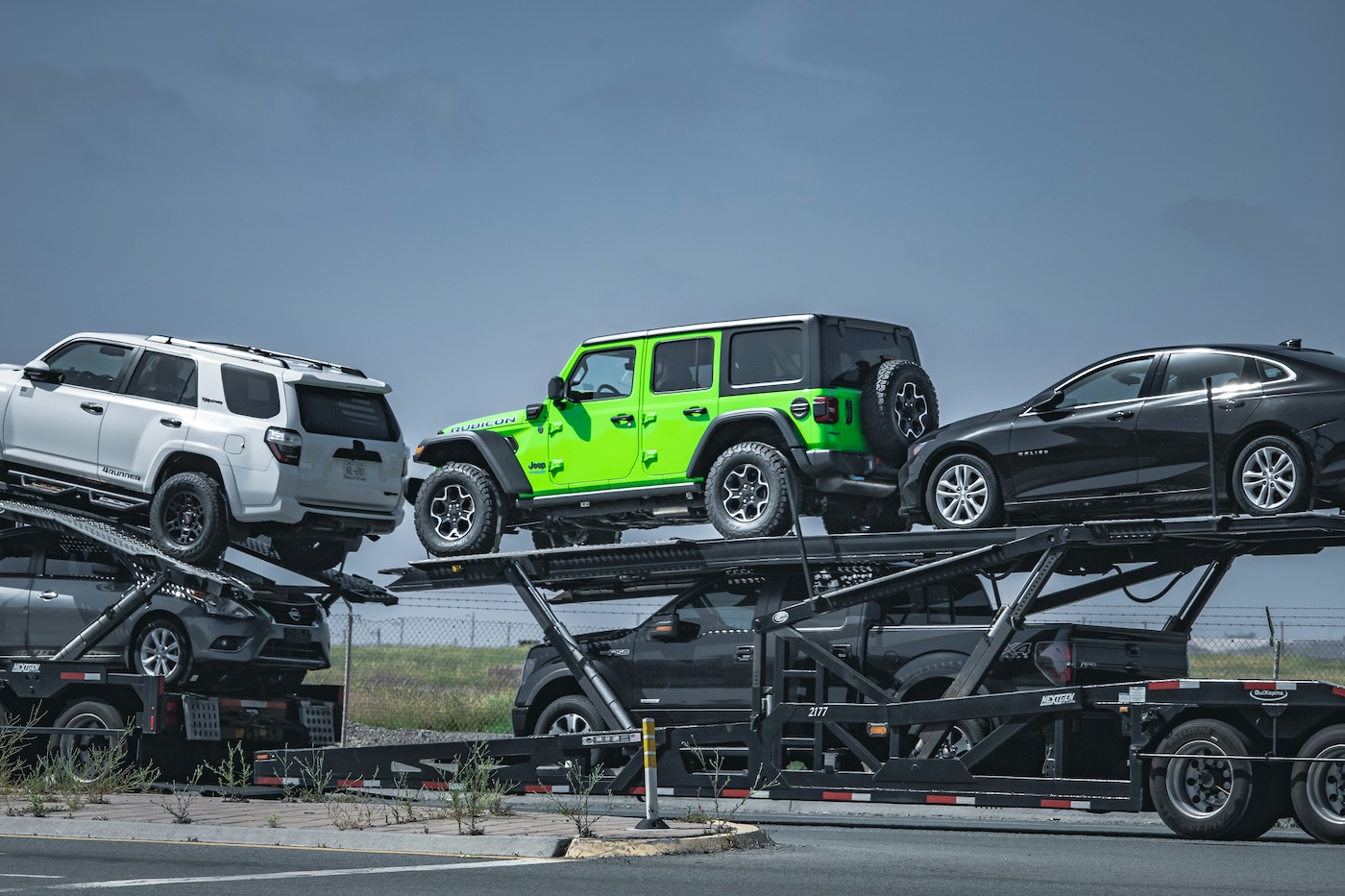 Car carrier truck loaded with vehicles on an open trailer